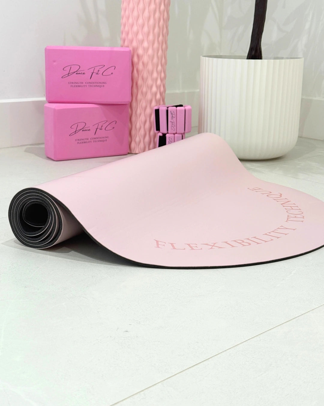 Dancer training on Dance Fit Co stretch mat for pilates and conditioning