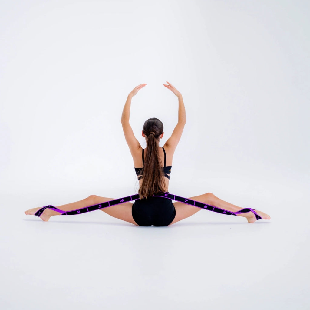 Person using a resistance band for stretching exercise on a white background