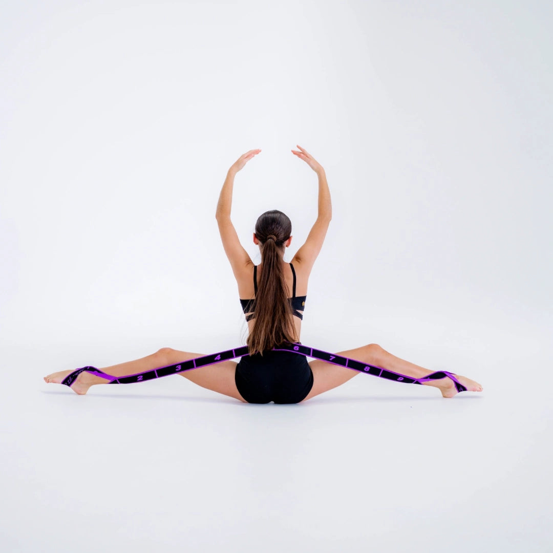 Person using a resistance band for stretching exercise on a white background